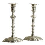 A PAIR OF GEORGE II PAKTONG CANDLESTICKS C.1740-50 each with a detachable foliate nozzle, above a