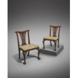 A PAIR OF GEORGE II MAHOGANY SIDE CHAIRS POSSIBLY IRISH, C.1740-50 each with a scroll top rail,