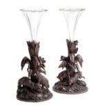 A PAIR OF BLACK FOREST LINDEN WOOD EPERGNES LATE 19TH CENTURY each carved with a central tree, one