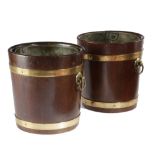A PAIR OF TEAK AND BRASS BOUND WINE BOTTLE HOLDERS / COOLERS IN REGENCY STYLE LATE 19TH / EARLY 20TH