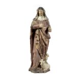A CARVED OAK AND POLYCHROME FIGURE OF ST. AGNES OF ARRAS FRENCH, 17TH / 18TH CENTURY the robed saint