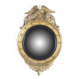 A GILTWOOD CONVEX WALL MIRROR IN REGENCY STYLE SECOND HALF 19TH CENTURY the circular plate within