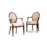 A PAIR OF GEORGE III MAHOGANY OPEN ARMCHAIRS IN THE MANNER OF JOHN LINNELL, C.1770-80 each with a