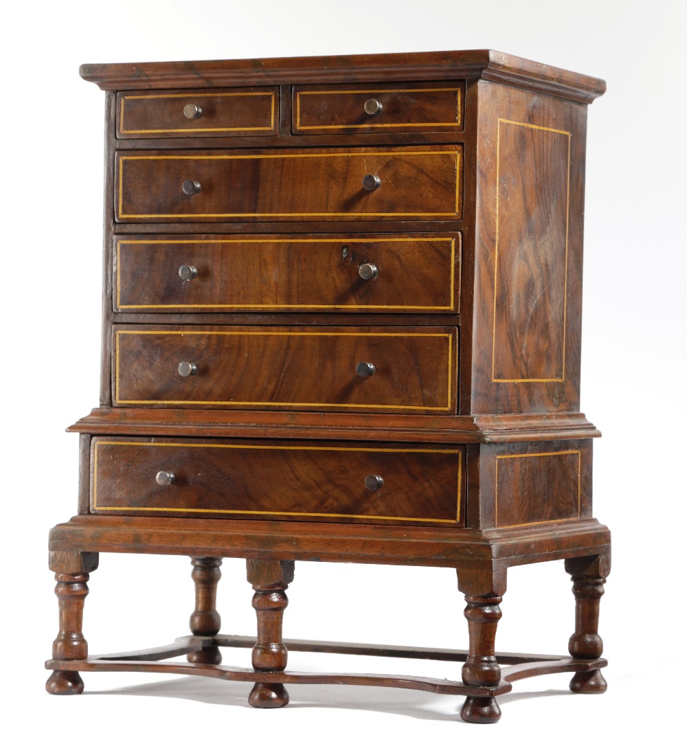 A WALNUT MINIATURE CHEST ON STAND IN WILLIAM AND MARY STYLE EARLY 20TH CENTURY inlaid with boxwood