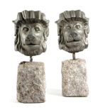 A PAIR OF CAST IRON LION'S MASK DOORSTOPS POSSIBLY LATE 19TH / EARLY 20TH CENTURY each silver