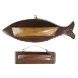 A FOLK ART CARVED MAHOGANY AND ASH BOAT WALL POCKET LATE 19TH CENTURY mounted on a fish backplate,
