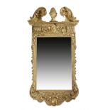 A LARGE GILTWOOD WALL MIRROR IN GEORGE II STYLE 19TH CENTURY the later rectangular plate within a