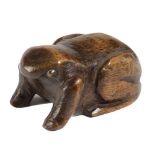 A TREEN FROG SNUFF BOX MID-19TH CENTURY with glass eyes, the underside with a sliding cover 7cm