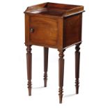 A GEORGE IV MAHOGANY BEDSIDE CUPBOARD BY GILLOWS C.1830 with a three-quarter gallery, above a door