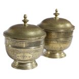 A PAIR OF ISLAMIC BRASS POTS AND COVERS PROBABLY 19TH CENTURY all over engraved with scrolling