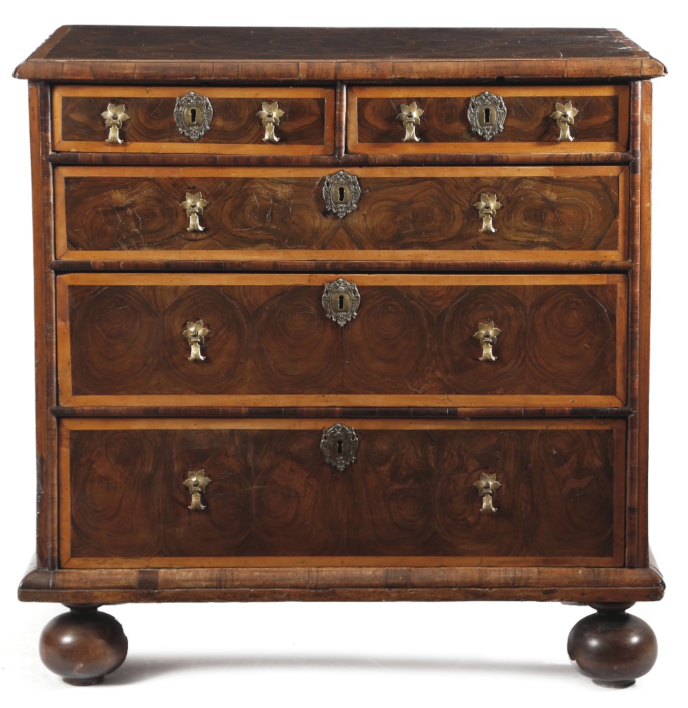 A WILLIAM AND MARY WALNUT OYSTER VENEERED CHEST C.1690 inlaid with holly banding and stringing,