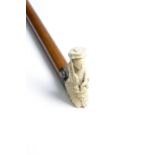 λ A RARE CHINESE IVORY HANDLED WALKING CANE C.1820 carved as a lady holding a basket of flowers in