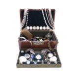 A leather jewellery box containing a quantity of jewellery, including a lady's diamond-set white g