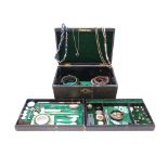 A leather jewellery casket containing a selection of jewellery, including a gold mourning brooch,