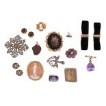 A large amethyst bead brooch, a paste cross brooch, a diamond-set putti charm, a pair of velvet