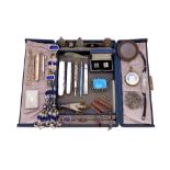 A jewellery box containing a quantity of jewellery, including various pocket knives, propelling