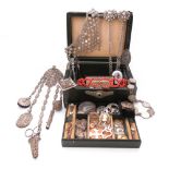 Two leather jewellery caskets containing a quantity of jewellery, including a Victorian gold and