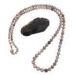 An untested pearl necklace and an untested baroque pearl