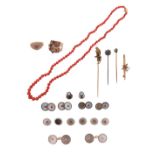 A mixed group of jewellery, including a coral bead necklace, a ruby and diamond cluster ring, a