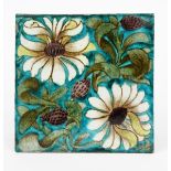 A large William De Morgan Merton Abbey Period tile, painted with two flower stems in green,