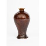 A Bernard Moore miniature baluster vase, covered in a rich aventurine glaze, printed Bernard