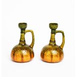 A pair of Ault Pottery jugs designed by Dr Christopher Dresser, ovoid body with cylindrical neck and