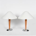 A pair of I Guzzini table lamps designed by Harvey Guzzini, domed chrome base supporting flaring