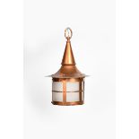 A copper ceiling lantern in the manner of the Birmingham Guild of Handicraft, tapering conical top