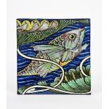 A William De Morgan Sand's End tile, painted with a leaping scaly fish swimming in a river, with