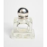 A silver mounted glass inkwell in the manner of Josef Hoffmann, square section glass well on foot,