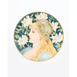 An Aesthetic Movement plate by S Donaldson, dated 1884, painted with a portrait of a woman before