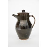 ‡ Gwyn Hansen Pigott (1935-2013) stoneware coffee pot and cover covered with a tenmoku glaze to the