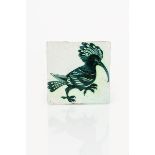 An early William De Morgan Hoopoe tile, painted with a standing bird in blue on an off white