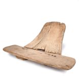 A Tiv stool Nigeria the two piece construction with large nails, 41cm high, 88.5cm wide.