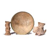 A Persian sgraffito pottery bowl decorated a central flowerhead and a scale ground with five rondals