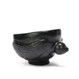 An Inuit zoomorphic bowl Siberia nephrite, modelled as a bird, with a pierced hole to the rim