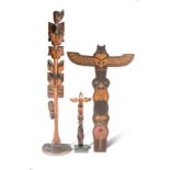 Three Northwest Coast model totems Canada with painted decoration, the smallest by Tom Moses,