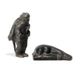 Two Inuit carved groups Isa Smiler (1921 - 1986) Canada A hunter with an otter strapped to his back,