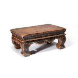 A Mongolian burrwood stand rectangular with moulded edges and short cabriole legs, 19th century,