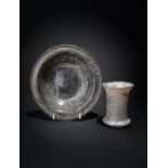 A Roman glass beaker circa 3rd - 4th century AD cylindrical with a flared mouth and rounded rim,