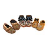 Three pairs of North American moccasins buckskin, velvet, glass beads and cotton, including an