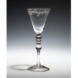 A large 'Newcastle' goblet c.1750, the generous round funnel bowl engraved with a border above a