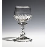 A mead glass c.1730, the cup bowl with gadroon moulding, raised on a stem with annulated top,