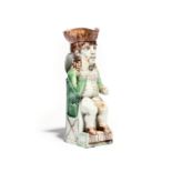 A Wood family Thin Man Toby jug c.1780, crisply modelled and seated on a stepped base, holding the