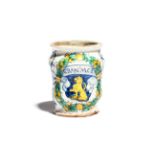 A small Italian maiolica albarello dated 1560, possibly Montelupo, the waisted form painted with a