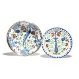 Two Samson Iznik-style dishes c.1880-90, the larger of shallow bowl form, painted with a central saz