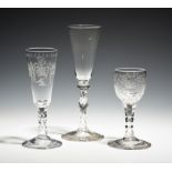 Three glasses c.1770-80, two ale glasses on faceted stems, the last a wine glass with ovoid bowl