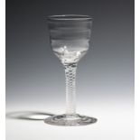 A Lynn wine glass c.1760, the ogee bowl with horizontal banding, raised on a single series opaque