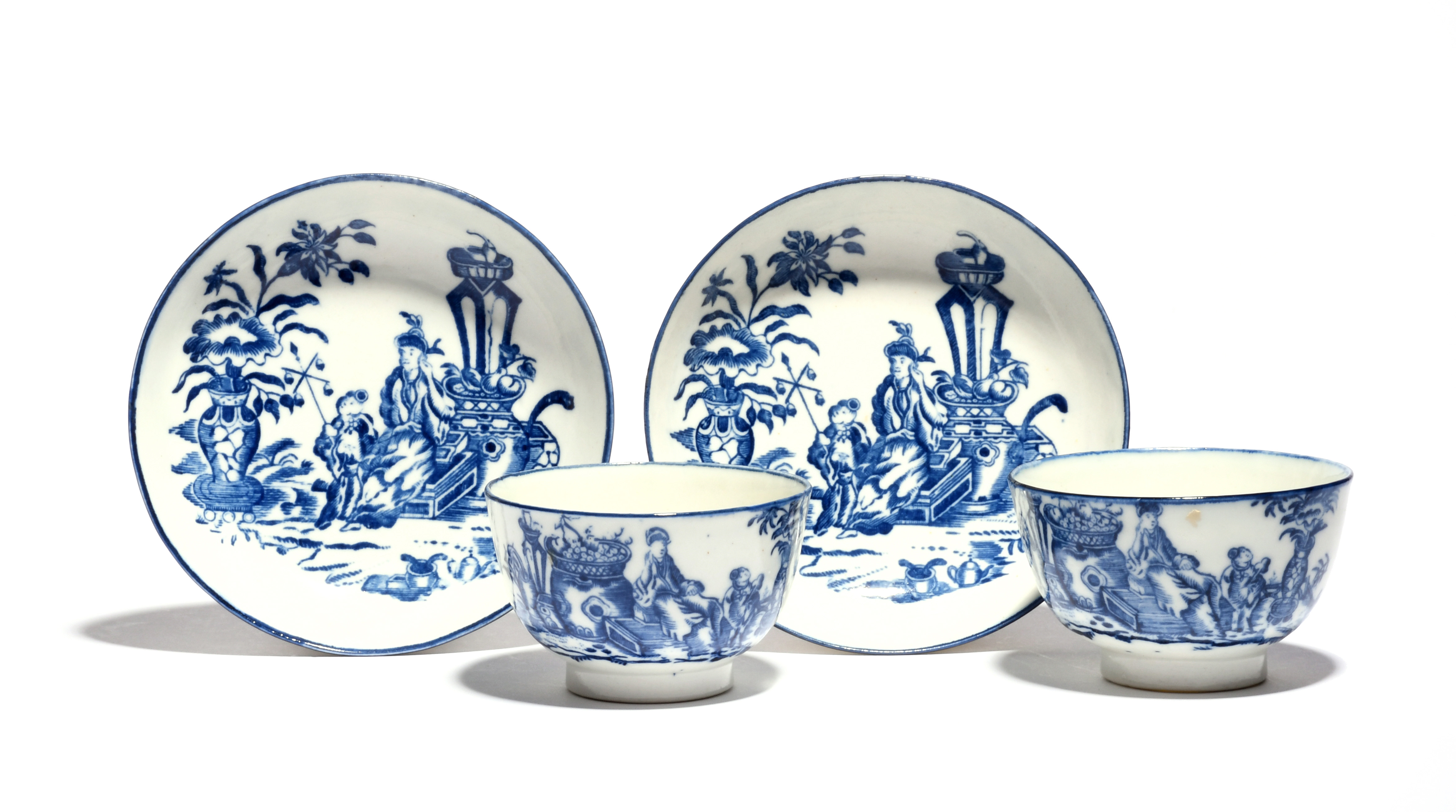 A pair of Caughley blue and white teabowls and saucers c.1770-80, printed with the Bell Toy