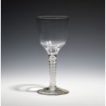A goblet c.1765, with ogee bowl raised on an unusual single series opaque twist stem above a conical